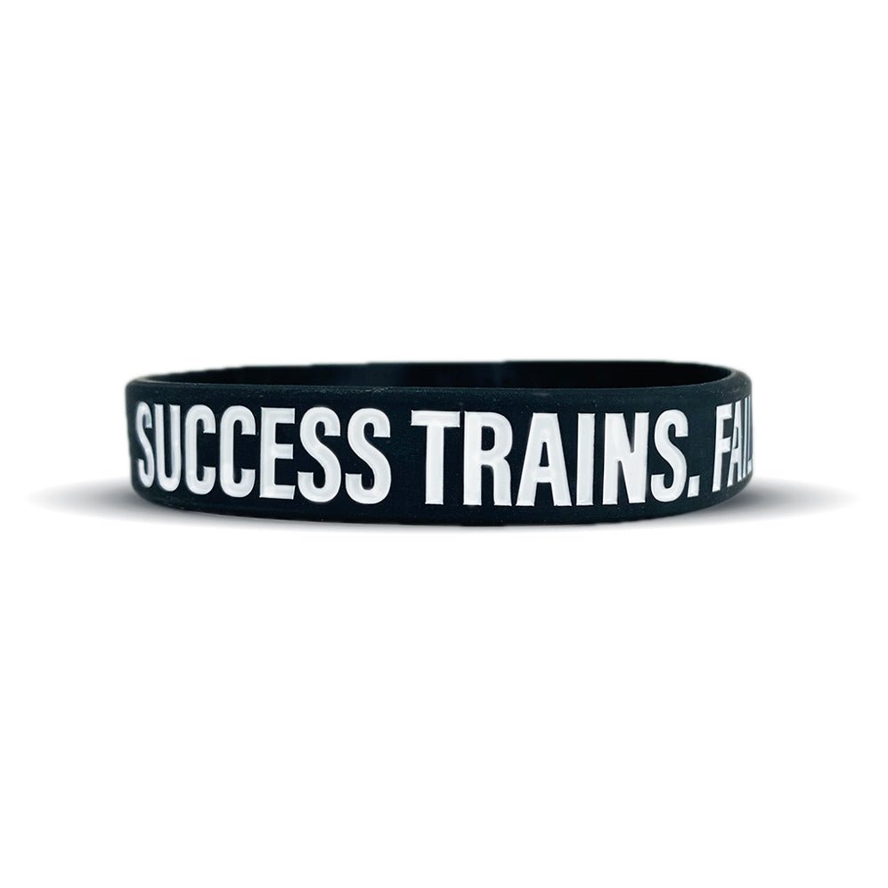 SUCCESS TRAINS. FAILURE COMPLAINS. Wristband - Pro Game Sports