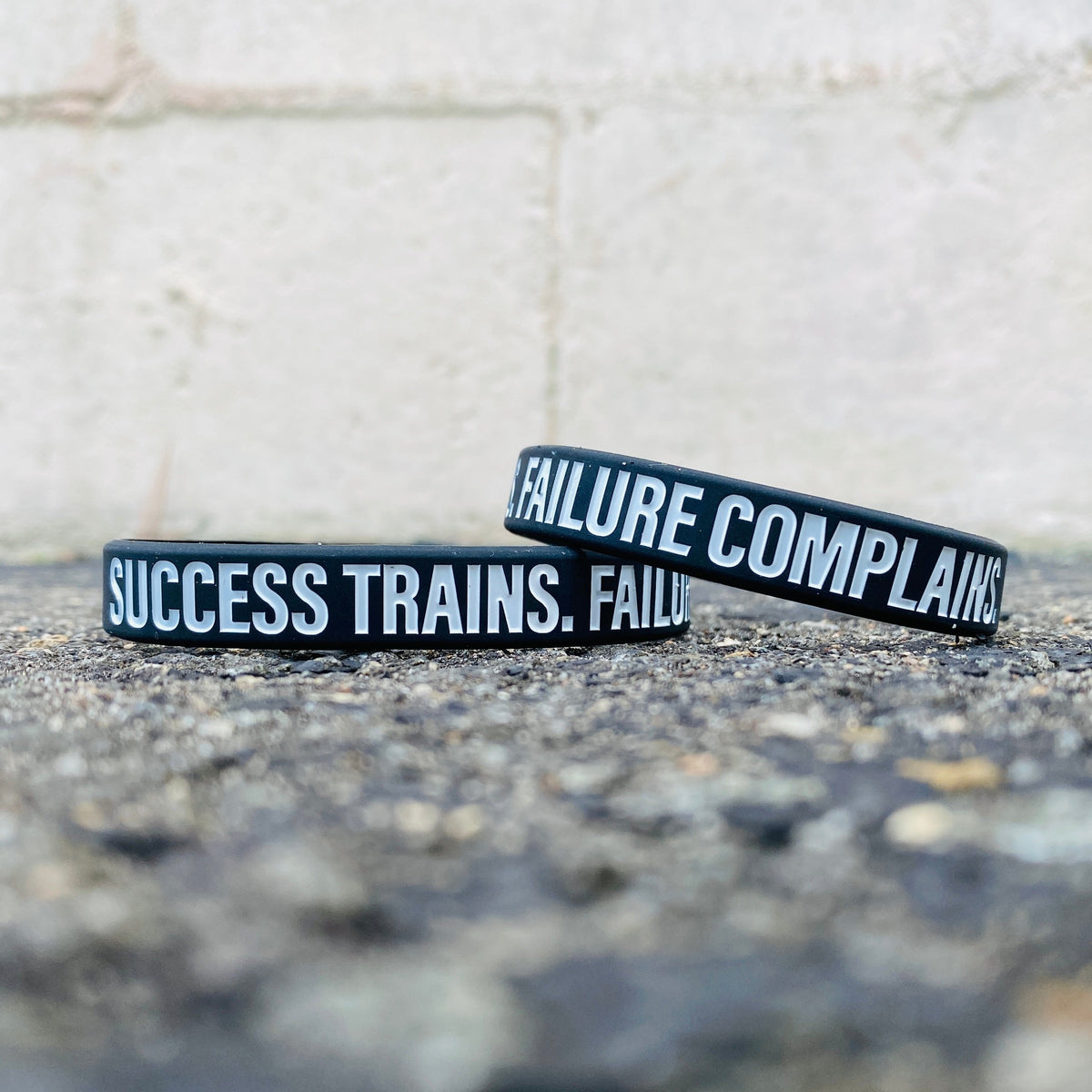 SUCCESS TRAINS. FAILURE COMPLAINS. Wristband - Pro Game Sports