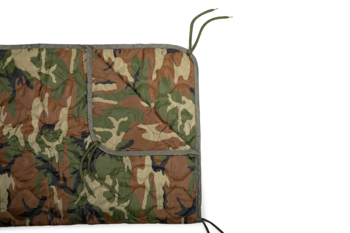 Camouflage-patterned mat with a white background