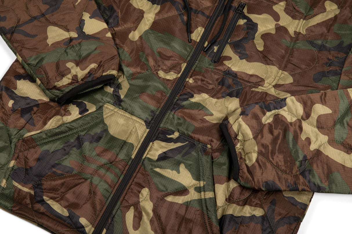 Camouflage-patterned fabric with a zipper