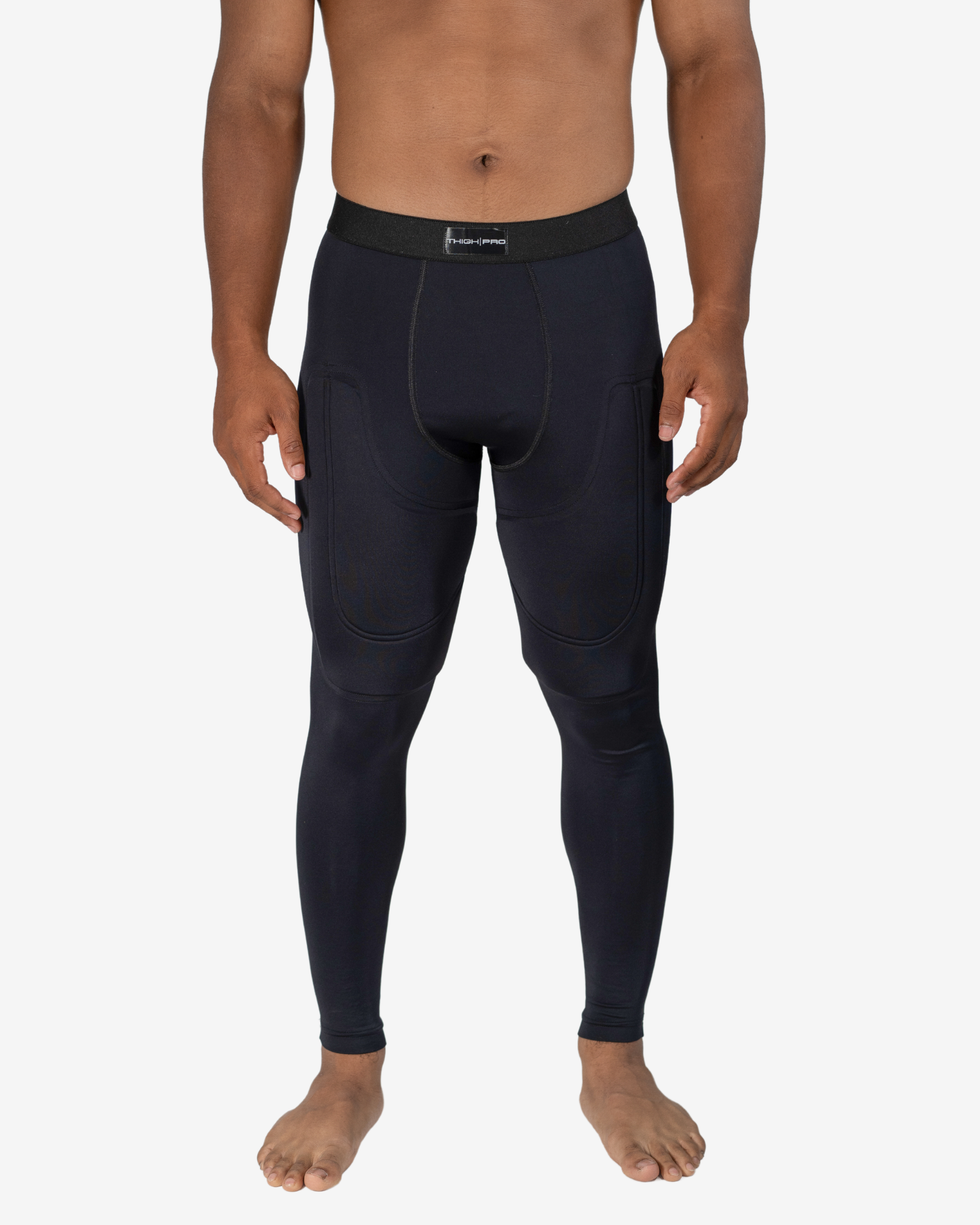 Person wearing black compression leggings on a white background