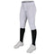 White softball pants with black leggings and cleats on a white background