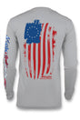 Long-sleeved gray t-shirt with a graphic print of the Betsy Ross flag in red, white, and blue on the back.