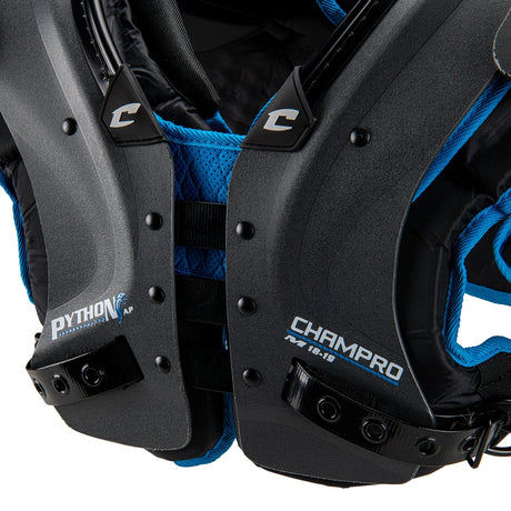 Close-up of a black and blue football shoulder pad with 'Champro' branding.