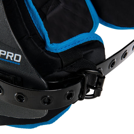 Close-up of a black and blue protective gear with 'Champro' branding on a white background