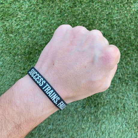 SUCCESS TRAINS. FAILURE COMPLAINS. Wristband - Pro Game Sports