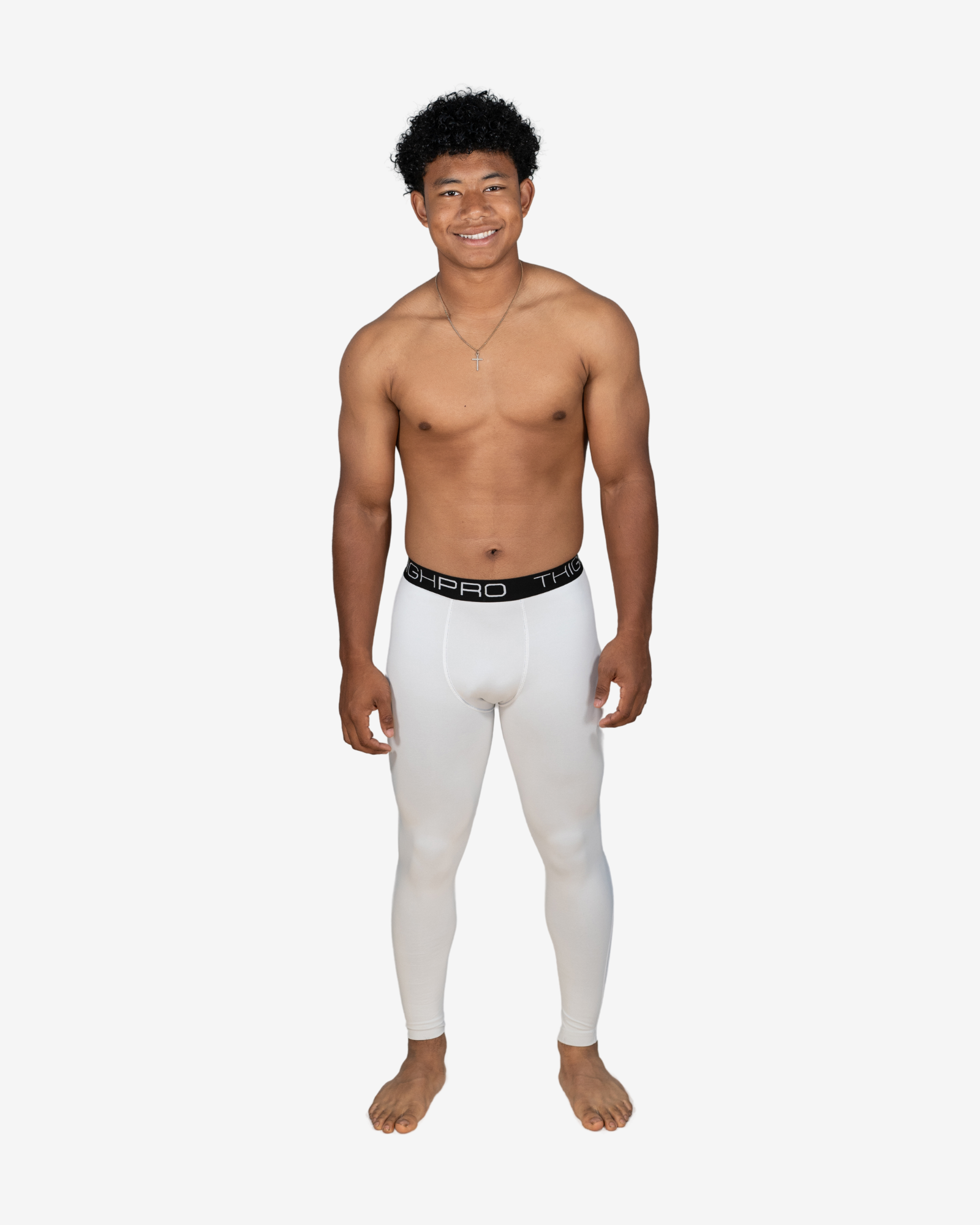 Man wearing white compression leggings with a black waistband on a white background