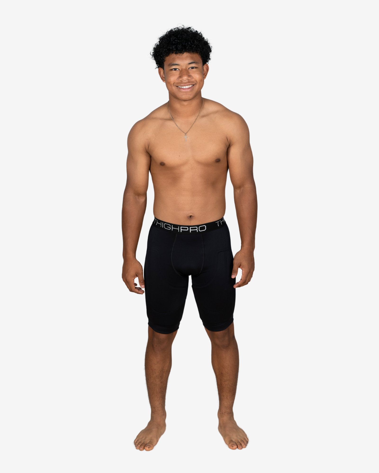 Man wearing black compression shorts with 'ASHPRO' branding on a white background