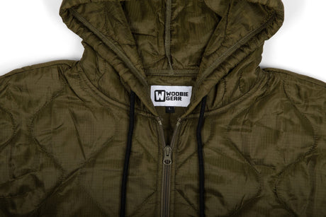 Olive green quilted jacket with a visible brand logo on a white background