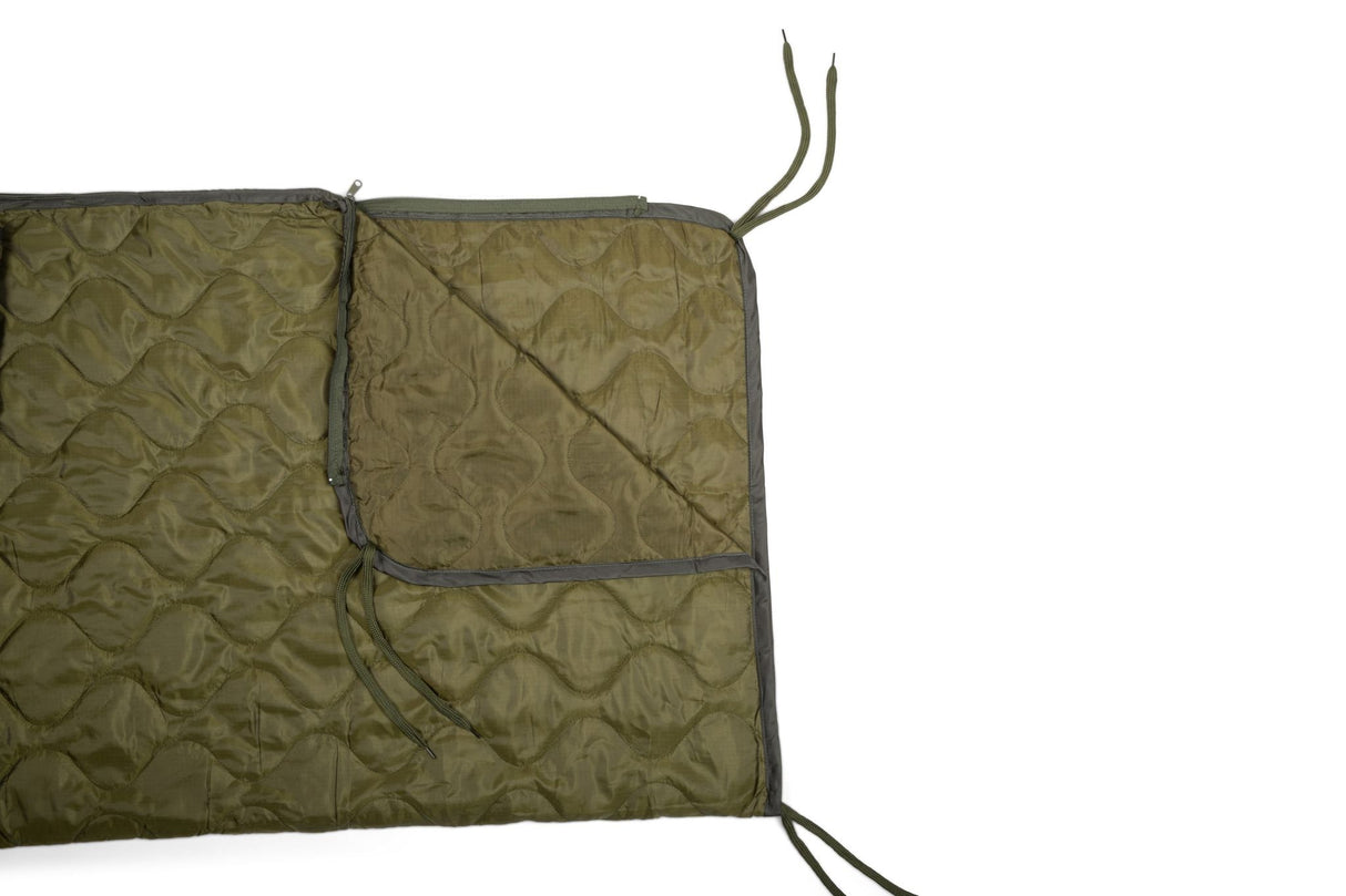 Green quilted blanket with drawstrings on a white background
