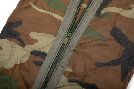 Camouflage-patterned jacket with a zipper on a white background