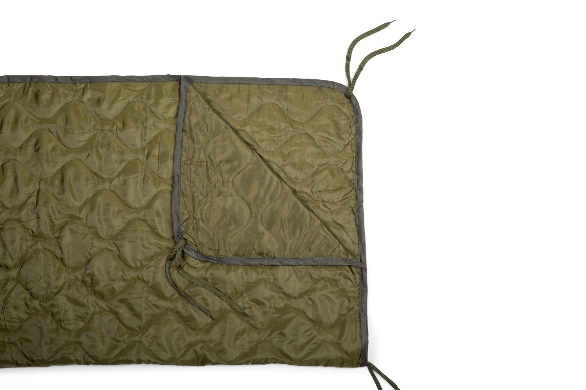 Green quilted blanket with gray border on a white background