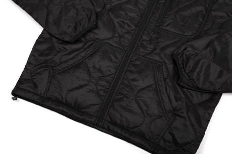 Black quilted jacket on a white background
