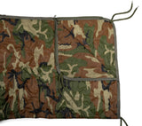 Camouflage-patterned blanket with a pocket on a white background