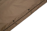 Brown fabric with button details on a white background