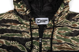 Camouflage jacket with a visible brand logo on a white background